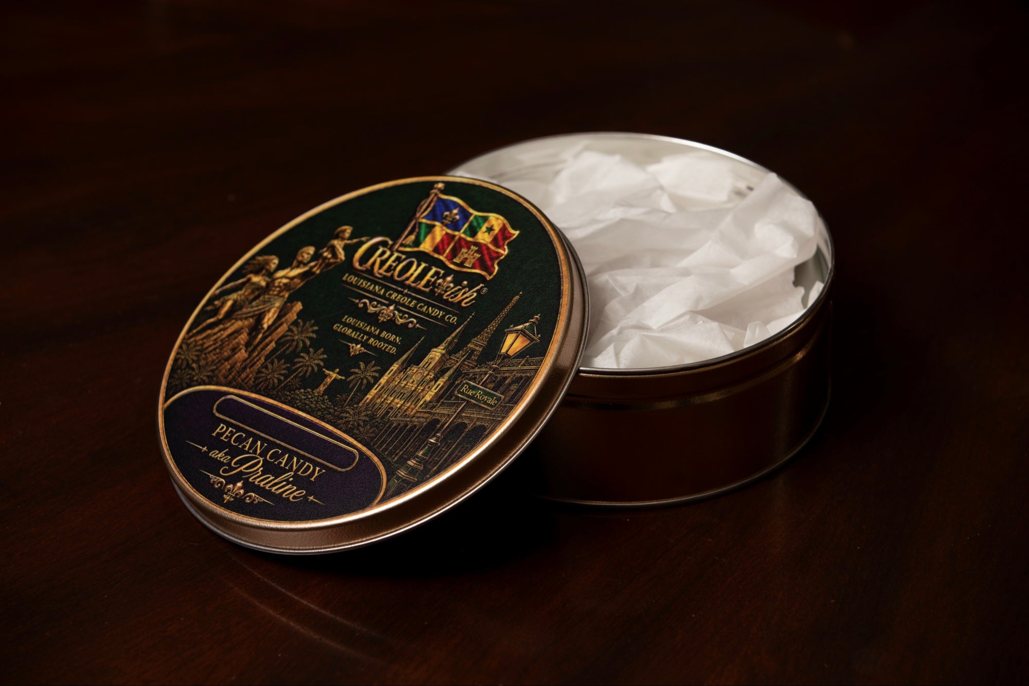 Creole-ish Louisiana Creole Candy Co. collector's tin, pecan candy aka praline, lid resting on the open tin